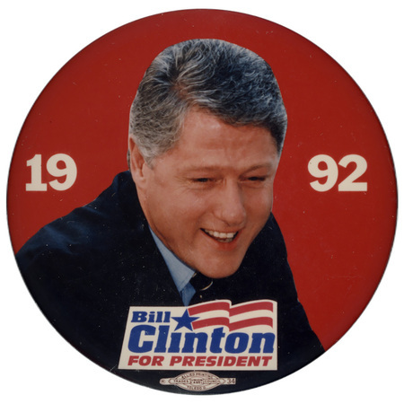 Round, red button with a color photograph of Bill Clinton. Text reads "1992 Bill Clinton FOR PRESIDENT"