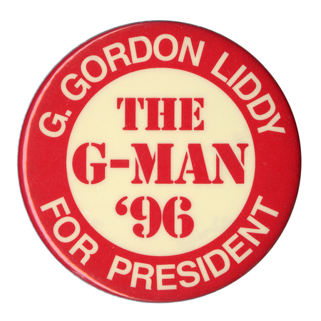Round, red and white button with contrasting white and red text reading "G. GORDON LIDDY FOR PRESIDENT THE G-MAN '96"