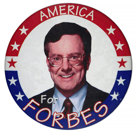 Round, white button with a red and blue border. In the center is a color photograph of Steve Forbes. White text reads "AMERICA For FORBES"