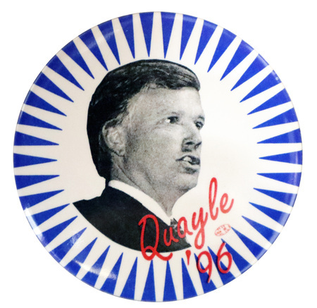 Round button with white rays against a blue background. In the center is a black and white photograph of Dan Quayle. Red text reads "Quayle '96"