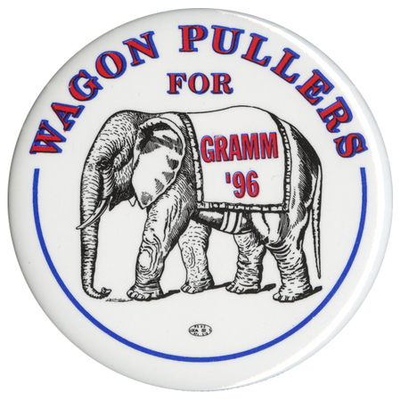 Round, white button with a black and white drawing of an elephant wearing a saddle blanket. Red text around the edge and on the blanket reads "WAGON PULLERS FOR GRAMM '96"
