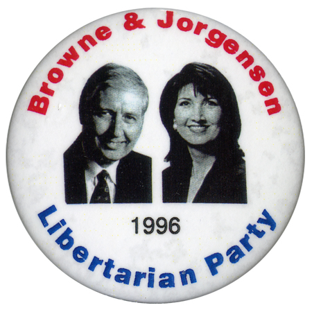 Round, white button with black and white photographs of Harry Browne and Jo Jorgensen. Red, blue, and black text reads "Browne & Jorgensen Libertarian Party 1996"
