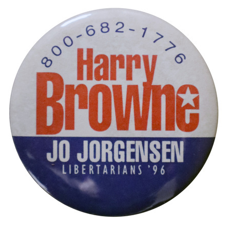 Round, white button with a band of blue along the bottom. Red, white and blue text reads "800-682-1776 Harry Browne Jo Jorgensen Libertarians '96"