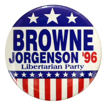 Round button with red, white, and blue stars and stripes decorations. Blue and red text reads "BROWNE JORGENSEN '96 Libertarian Party"