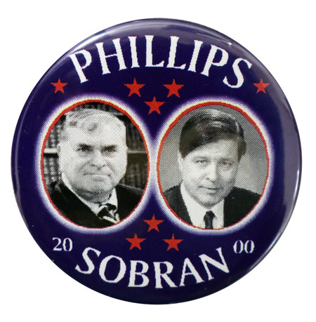 Round, blue button with black and white photographs of Howard Phillips and Michael Joseph Sobran in red-outlined circles. White text reads "PHILLIPS SOBRAN 2000"