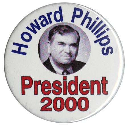 Round, white button with a black and white photograph of Howard Phillips. Blue and red text reads "Howard Phillips President 2000"