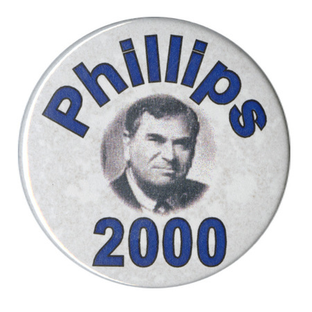 Round, white button with a black and white photograph of Howard Phillips and blue text reading "Phillips 2000"