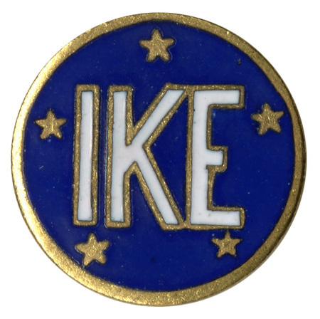 Round, enameled blue pin with gold stars and white text reading "IKE"