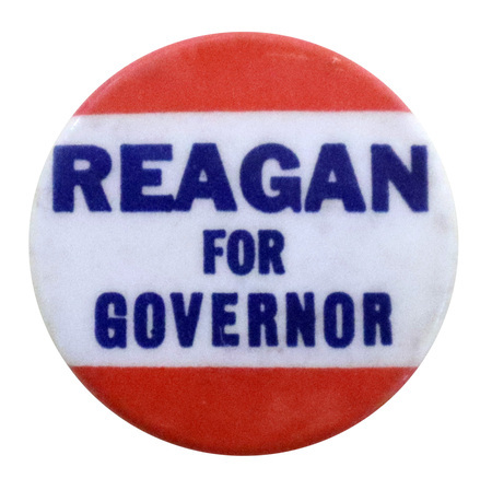 Round button with horizontal bands of red and white. Blue text reads "REAGAN FOR GOVERNOR"