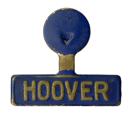 Blue, fold over lapel pin with gold text reading "HOOVER"