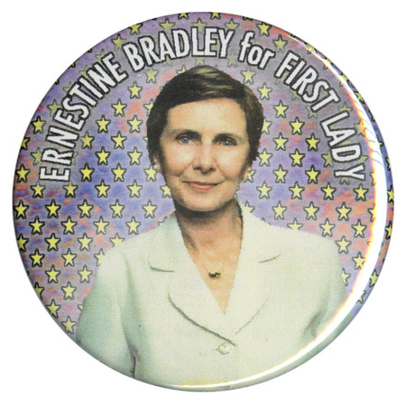 Round button with a color photograph of Ernestine Bradley against a blue and red background patterned with yellow stars. White text reads "ERNESTINE BRADLEY for FIRST LADY"