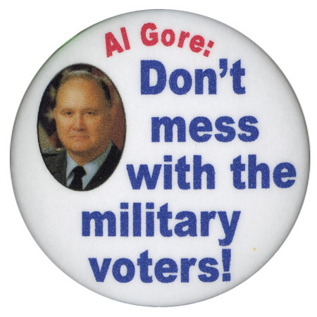 Round, white button with a color photograph of an unidentified man and red and blue text reading "Al Gore: Don't mess with the military voters!"