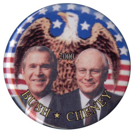 Round button with color photographs of George W. Bush and Dick Cheney against a blurry color image of an eagle and a US flag. White and yellow text reads "2000 BUSH CHENEY"