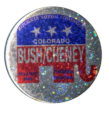 Round, sparkly silver button with a red, white, and blue GOP elephant symbol. Silver and black text within the elephant symbol reads "REPUBLICAN NATIONAL CONVENTION COLORADO BUSH/CHENEY AUGUST 3, 2000 Philadelphia, Pennsylvania"