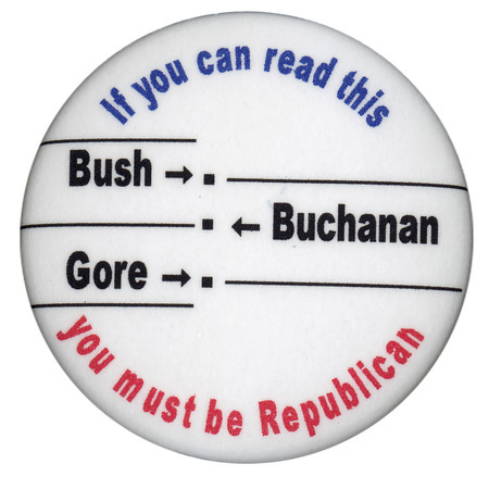 Round, white button with blue and red text reading "If you can read this you must be Republican". In black text, the names "Bush", "Gore", and "Buchanan" are arranged alongside each other in the manner of the "butterfly ballot" used in Palm Beach County, Florida, during the 2000 election.