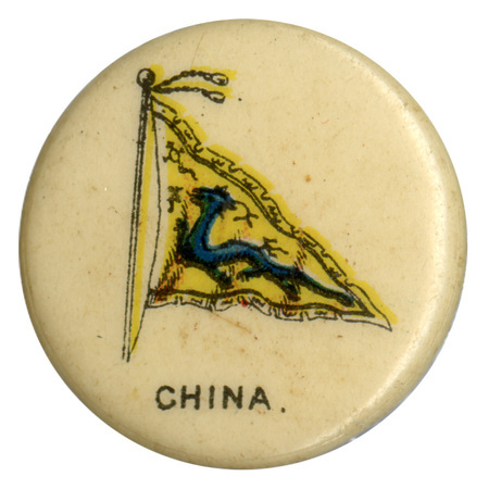 Round, white button with a color illustration of the flag standard of the Qing Emperor of China, a blue dragon on a yellow background. Black text reads "CHINA."