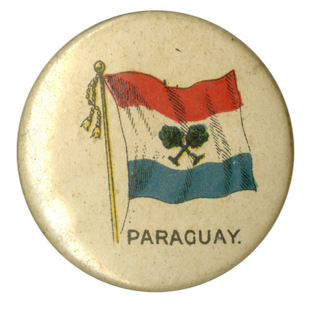 Round, white button with a color illustration of a 19th century Paraguayan flag, horizontal red, white, and blue bands with crossed trees in the center. Black text at the bottom reads "PARAGUAY."