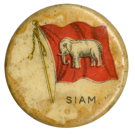 Round, white button with a color illustration of the historical national ensign flag of Siam (Thailand), a white elephant on a red field. Black text at the bottom reads "SIAM."