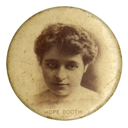 Round, white button with a black and white photograph of Hope Booth. Black text at the bottom reads "HOPE BOOTH"