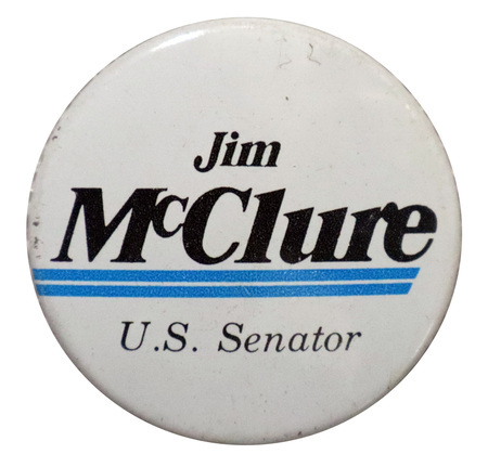 Round, white button with horizontal blue stripes and black text that reads "Jim McClure U.S. Senator"
