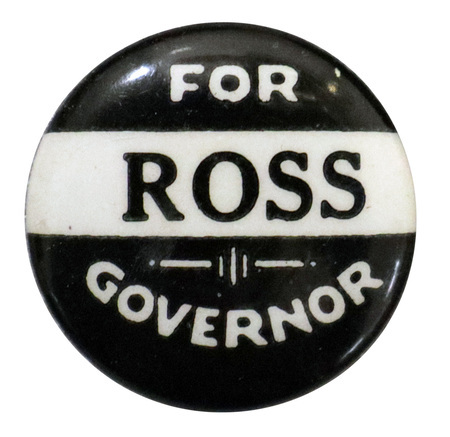 Round, black button with a horizontal band of white across the middle. White and black text reads "FOR ROSS GOVERNOR"