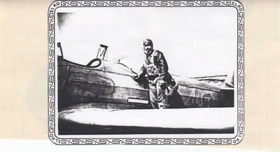 Photograph of Calnon in pilot suit outside training plane.