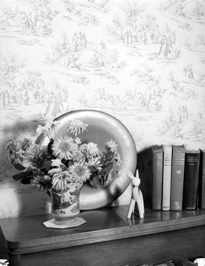 1939 photograph of the Home Management House. Shelf top display including flowers. [PG1_106-05]