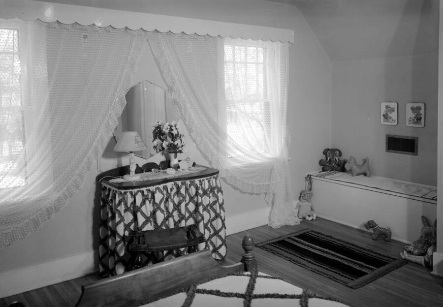 1945 photograph of the Home Management House. View of a bedroom. [PG1_106-09]
