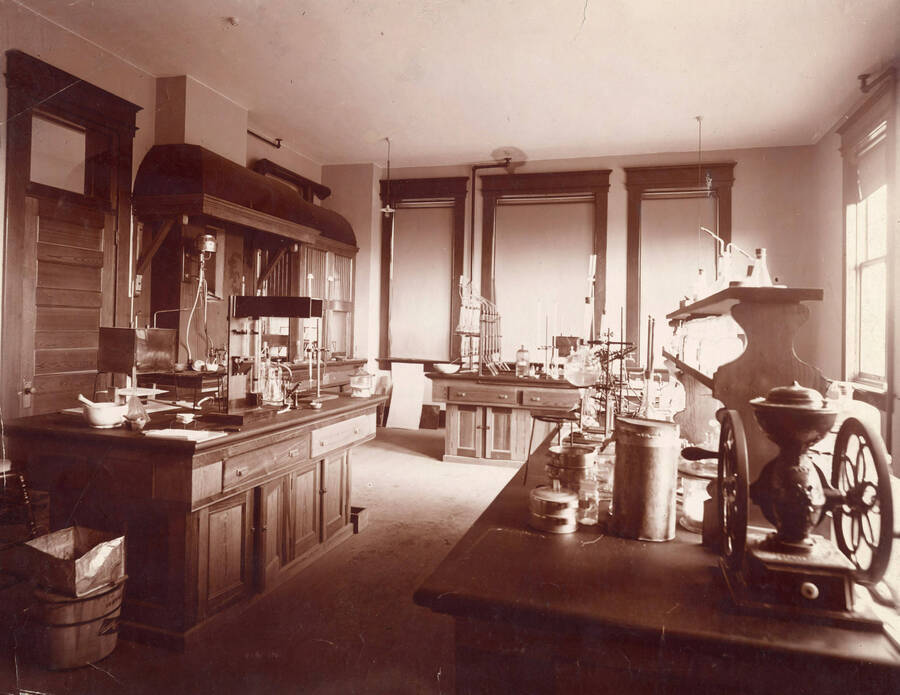 1926 photograph of Mines Building. Laboratory equipment in foreground. [PG1_107-02]