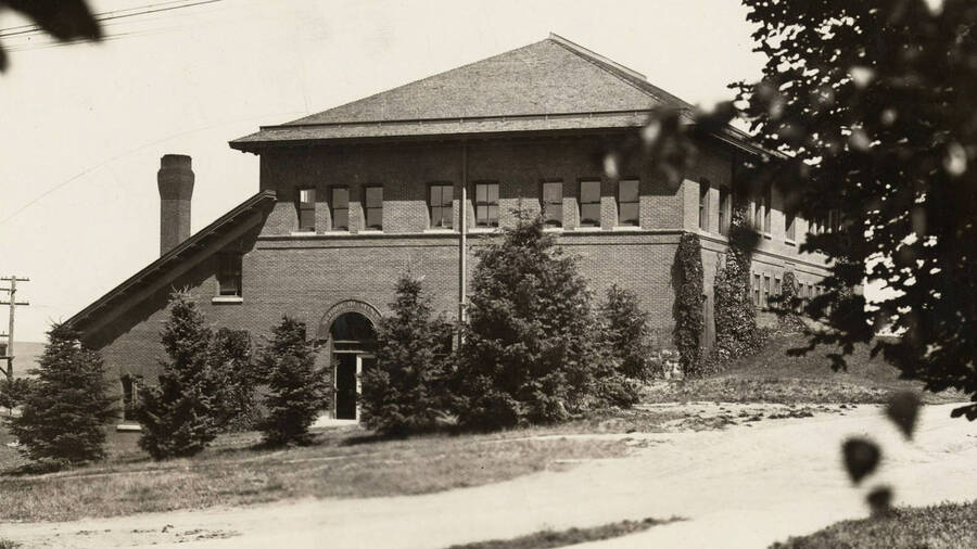1910 photograph of Mines Building. Trees in foreground. [PG1_107-07]