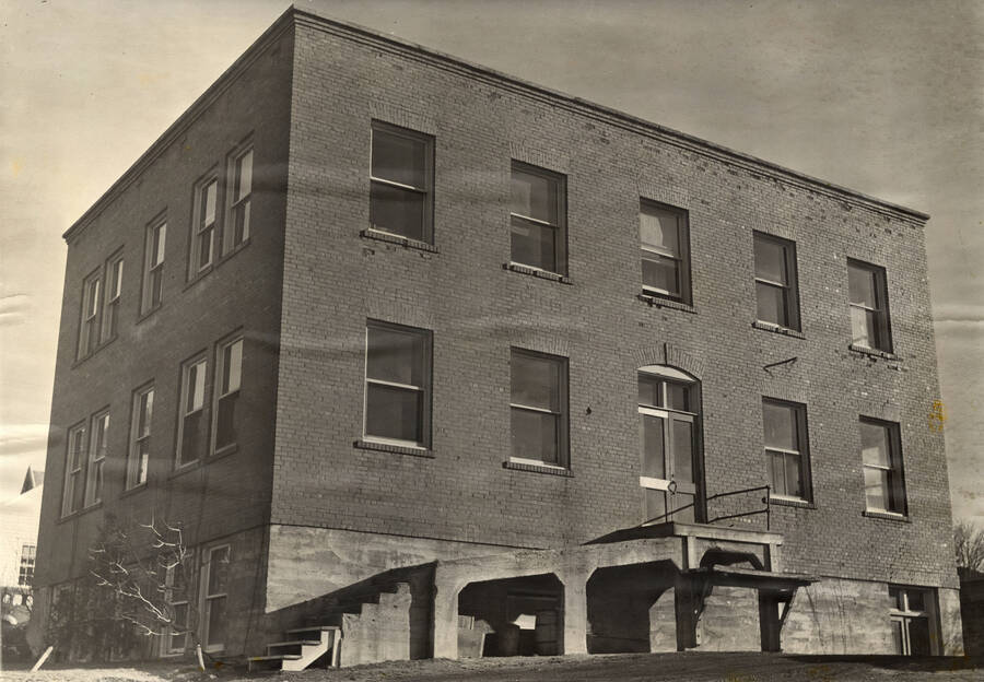 1930 photograph of Dairy Science Building. Bare trees to left. [PG1_108-02]