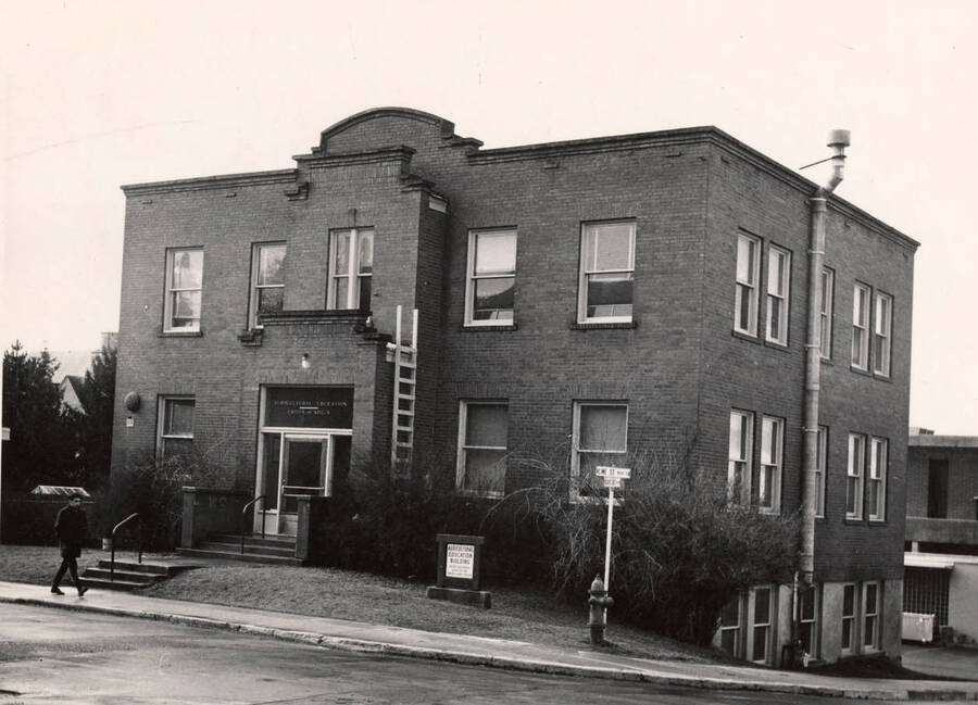 1945 photograph of Agronomy Building. A ladder is propped against the building entrance. [PG1_109-06]