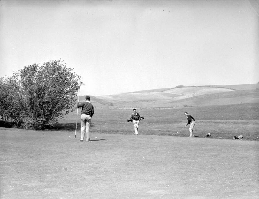 1950 photograph of the Golf Course. Players in foreground. [PG1_110-09]