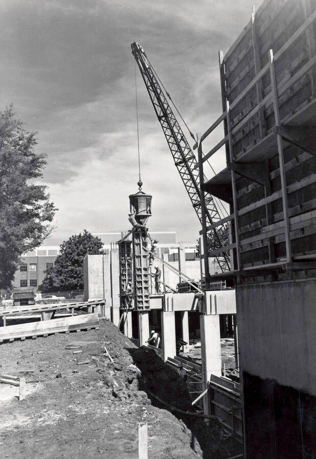 1974 photograph of Agricultural Science Building. Construction workers in center of image. [PG1_111-13]
