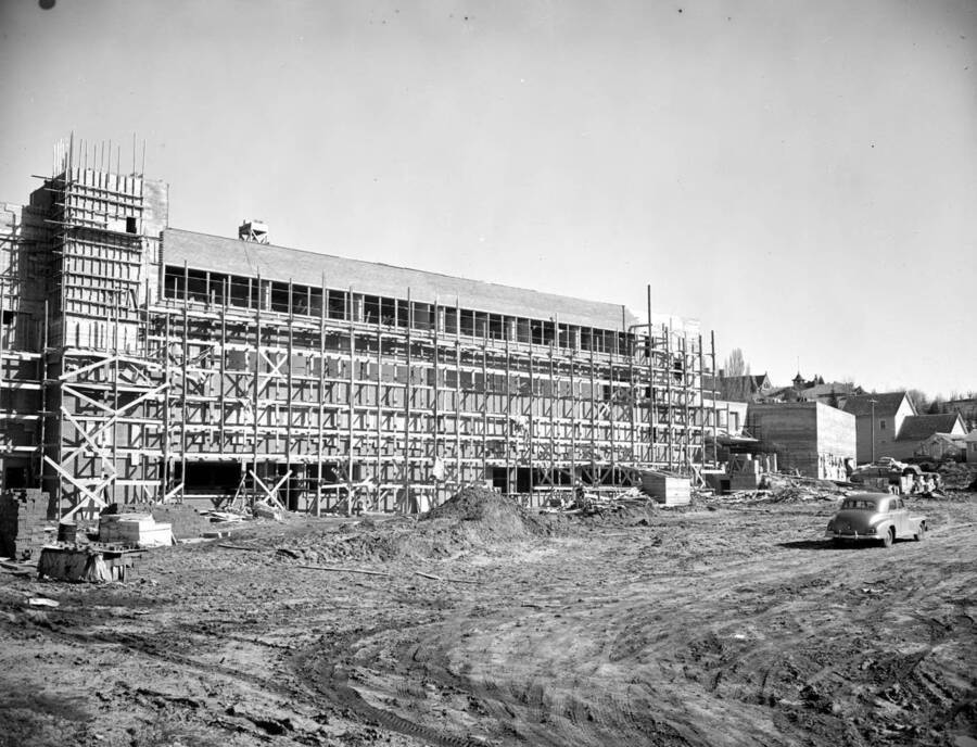 April 4, 1950 photograph of the Agricultural Science Building under construction. Automobile in foreground. [PG1_111-22b]