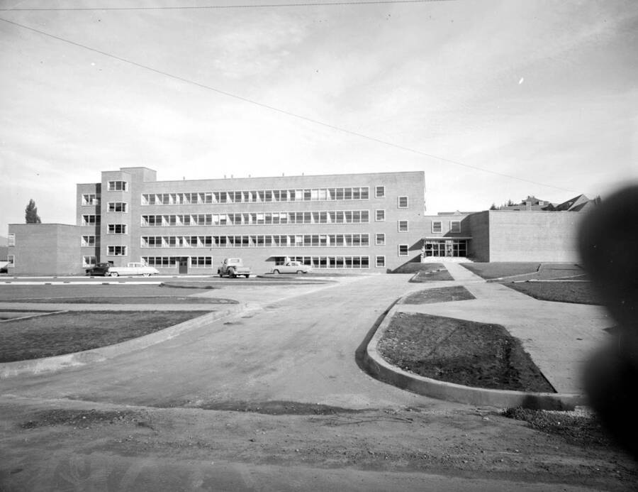 October 19, 1950 photograph of the Agricultural Science Building under construction. Automobiles in foreground. [PG1_111-24a]