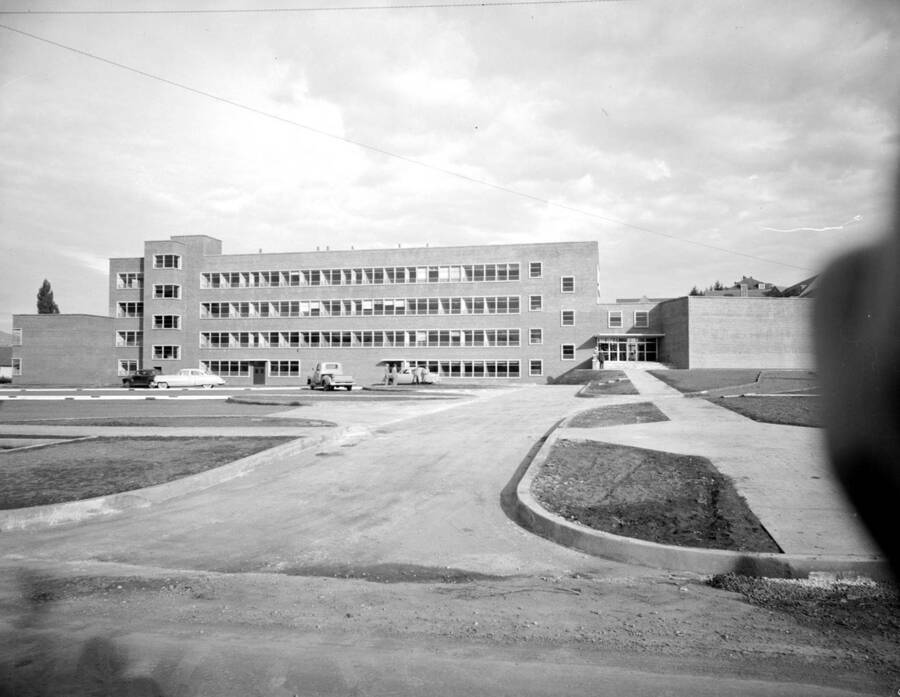 October 19, 1950 photograph of the Agricultural Science Building under construction. Automobiles in foreground. [PG1_111-24b]