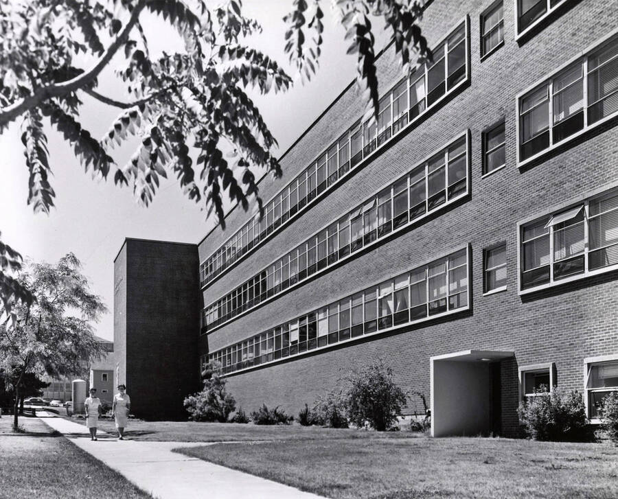 1955 photograph of Agricultural Science Building. Students in foreground. Donor: Publications Dept.. [PG1_111-07a]