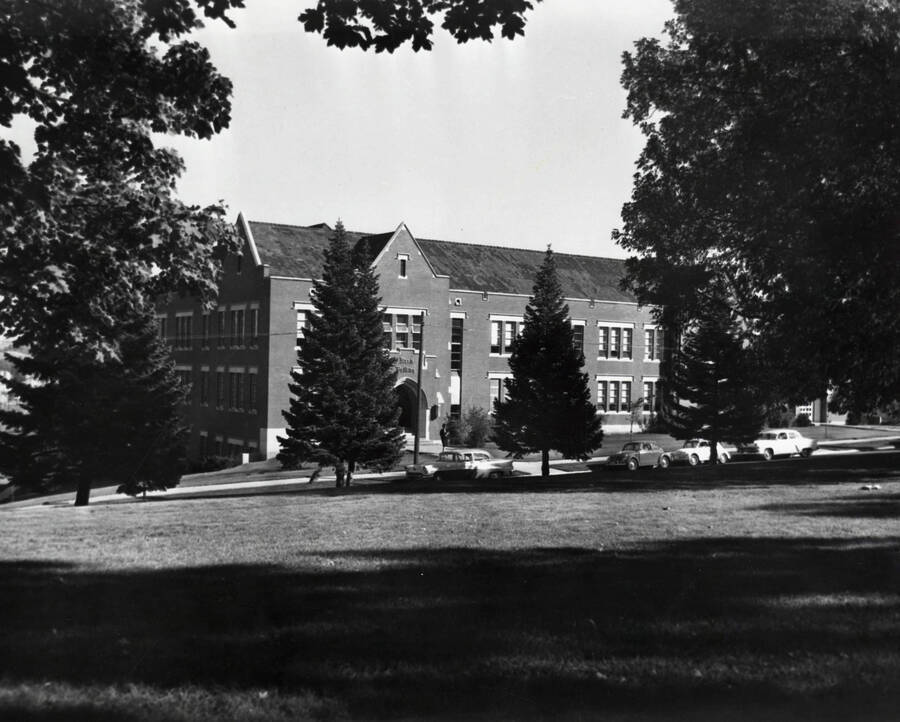 1960 photograph of Music Building. Automobiles in front of building. Donor: Photo Center. [PG1_117-12]
