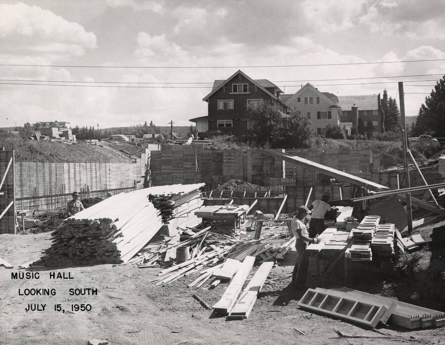 July 15, 1950 photograph of the Music Building under construction. Houses in the background. [PG1_117-15a]