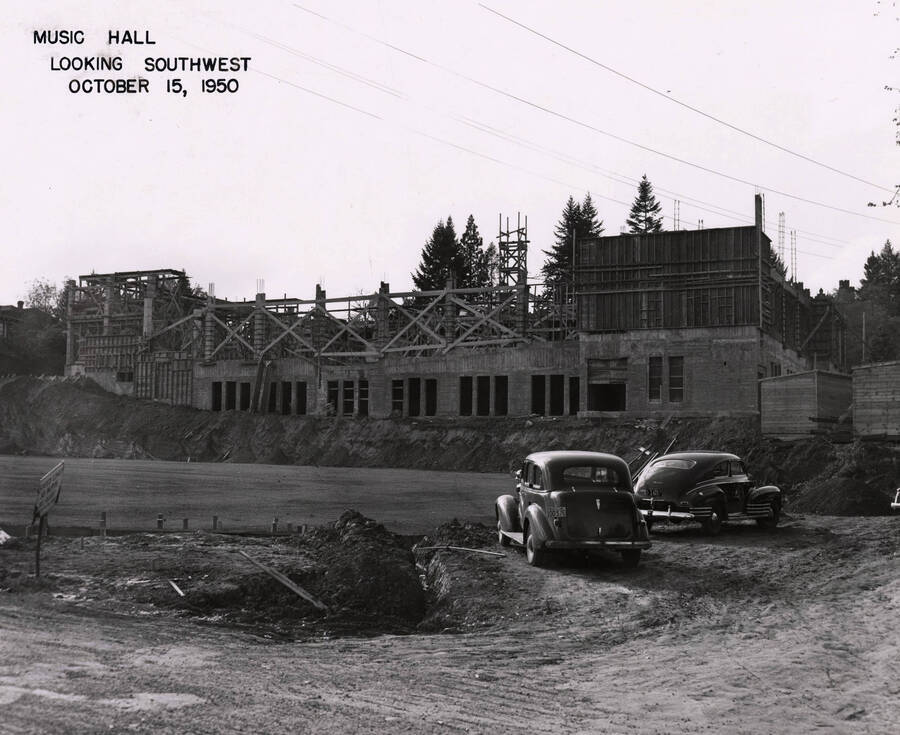 October 15, 1950 photograph of the Music Building under construction. Automobiles in the foreground. [PG1_117-18a]