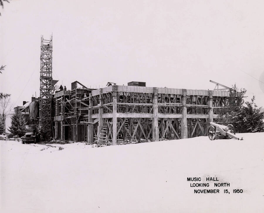 November 15, 1950 photograph of the Music Building under construction. Cannon in foreground. [PG1_117-19a]