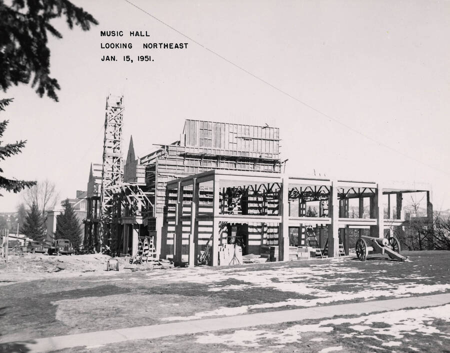 January 15, 1951 photograph of the Music Building under construction. Cannon in foreground. [PG1_117-21b]