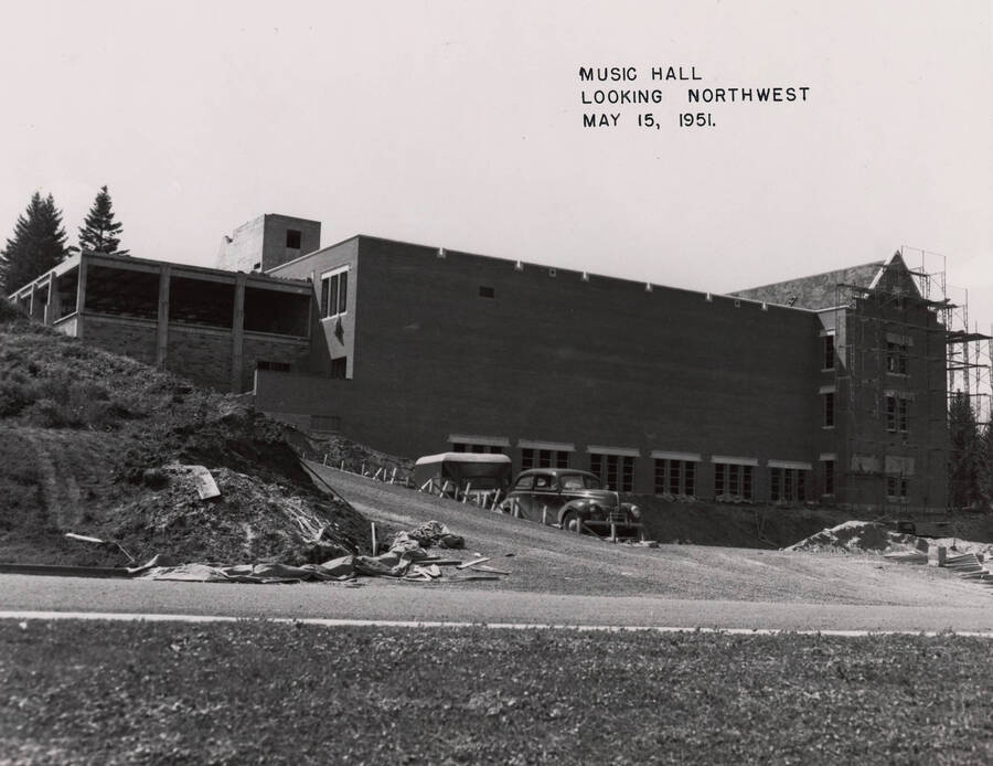 May 15, 1951 photograph of the Music Building under construction. Automobile in foreground. [PG1_117-25]