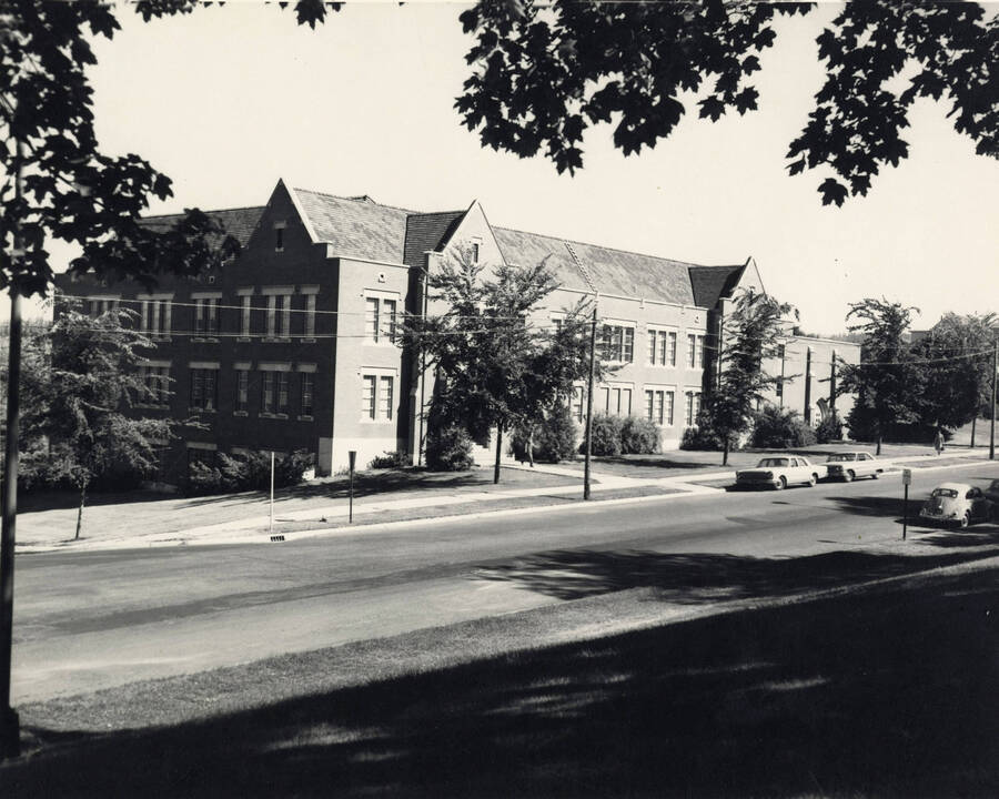1960 photograph of the Music Building. Automobiles in foreground. [PG1_117-29]