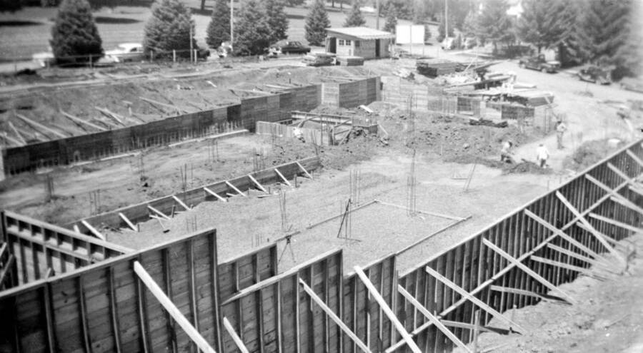 1950 photograph of the Music Building under construction. Construction workers in background. [PG1_117-30]