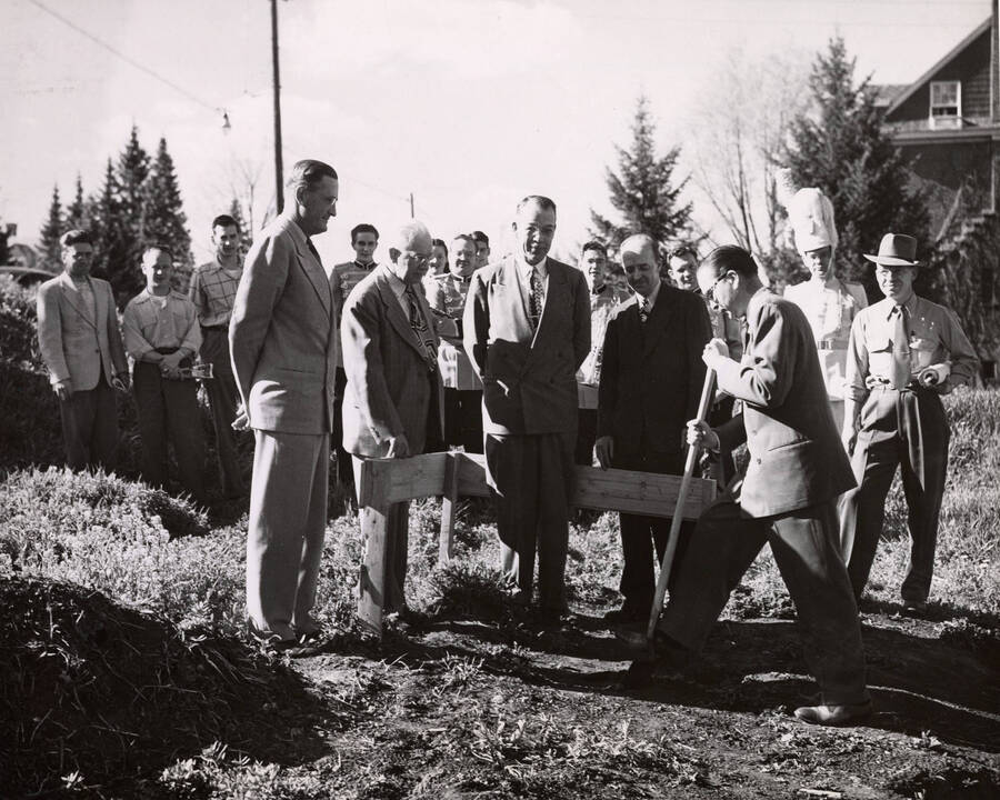 1952 photograph of the groundbreaking ceremony for the Music Building. Left to right: Regent W.F. McNaughton, Governor C. A. Robins, President J.E. Buchanan. Donor: Publications Dept. [PG1_117-09a]