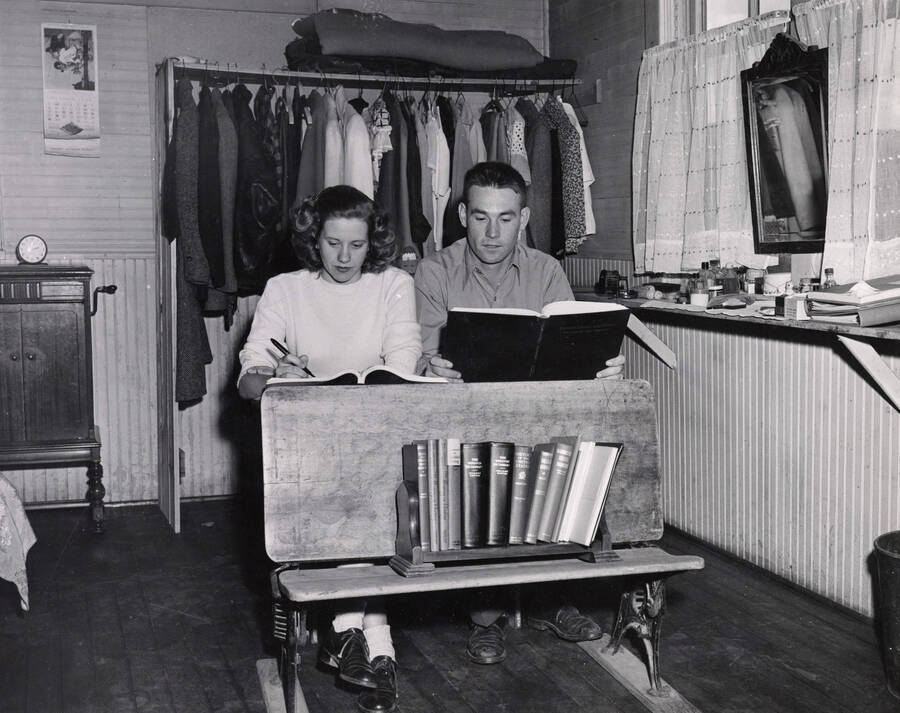 1950 photograph of the Field House. Students study in foreground. [PG1_119-04]