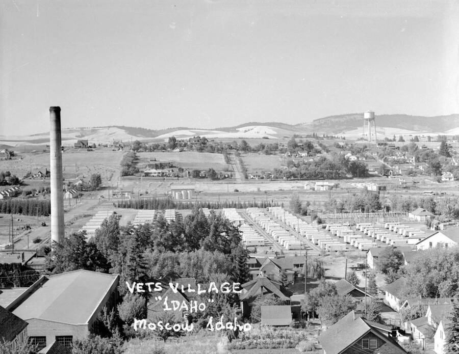 1948 photograph of Veterans Housing. Steam tower and water tower in background. [PG1_120-04]