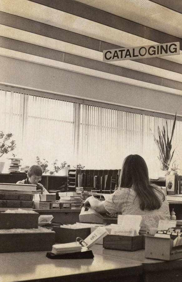 1978 photograph of the Library. Left to right: Henrietta Pew and Karen Eckert in the Technical Services department. [PG1_122-083a]